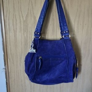 This is a beautiful Blue Swade leather purse with lots of pockets, like new